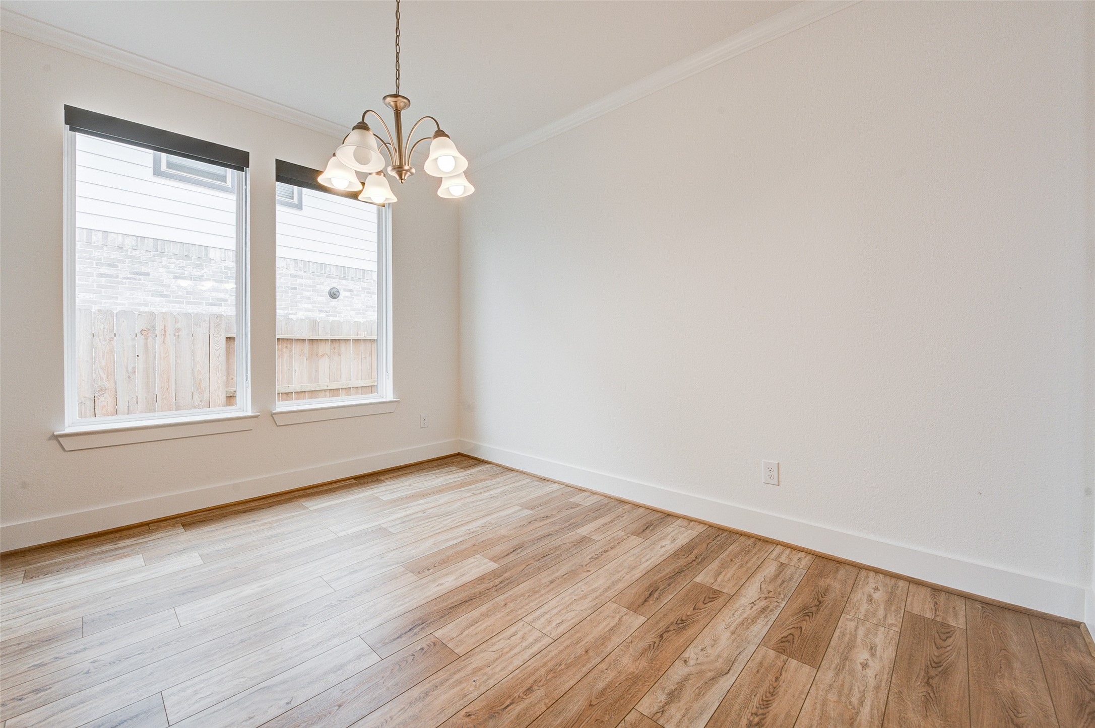 4606 Wax Myrtle Court Fulshear, TX 77441 - Photo 7 of 36 wooden floor in an empty room with a window