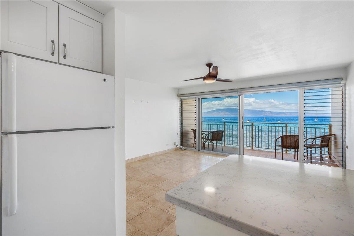 1403 Front Street, Unit 309 Lahaina, HI 96761 - Photo 13 of 33 a view of a livingroom with furniture and a ceiling fan