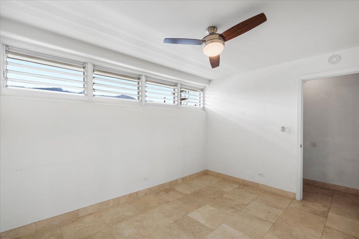 1403 Front Street, Unit 309 Lahaina, HI 96761 - Photo 17 of 33 an empty room with windows and fan