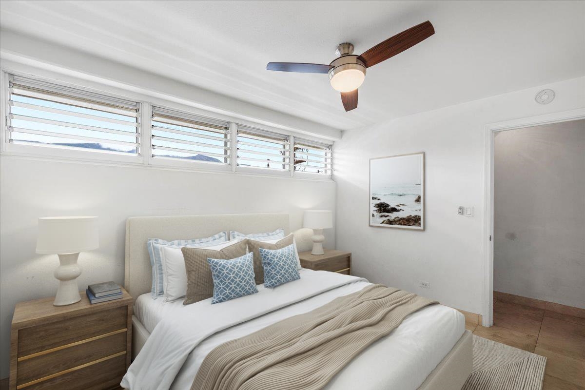 1403 Front Street, Unit 309 Lahaina, HI 96761 - Photo 18 of 33 a bedroom with a bed and cabinets