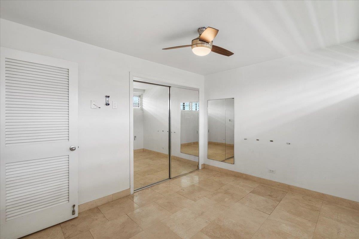 1403 Front Street, Unit 309 Lahaina, HI 96761 - Photo 20 of 33 an empty room with closet and windows
