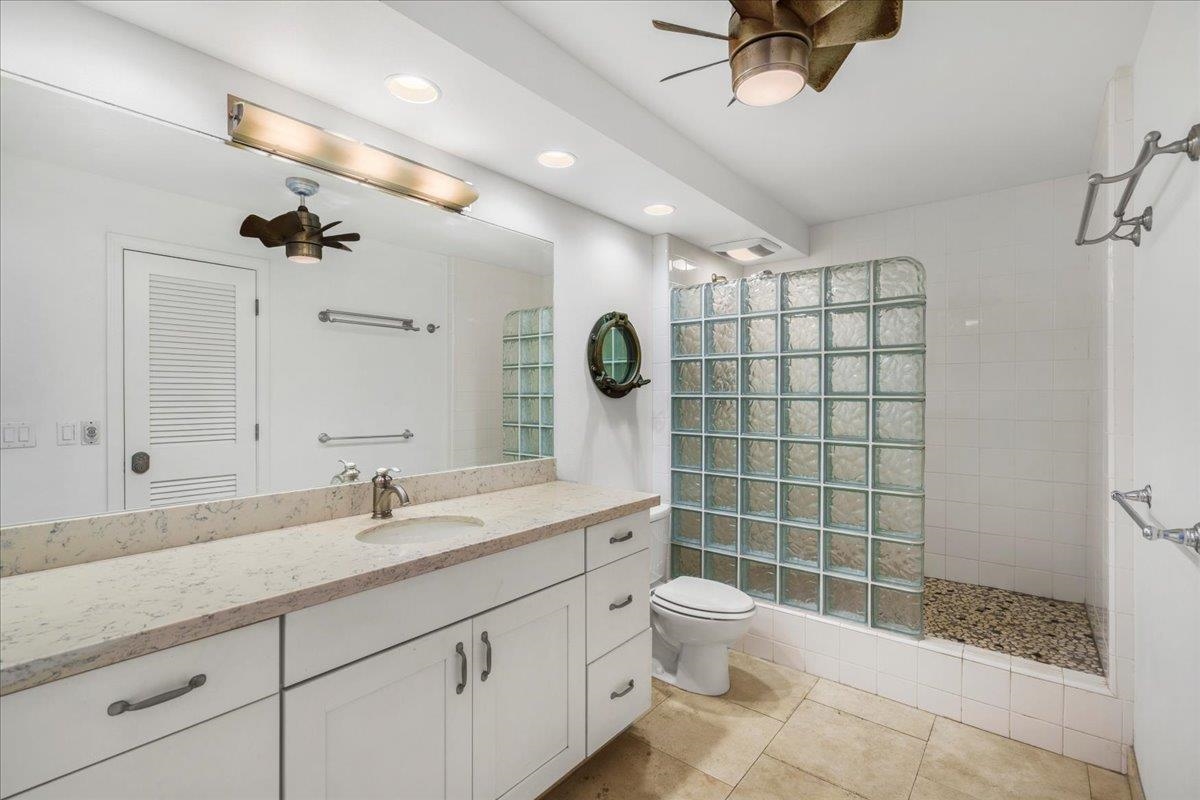 1403 Front Street, Unit 309 Lahaina, HI 96761 - Photo 22 of 33 a bathroom with a sink a toilet and shower