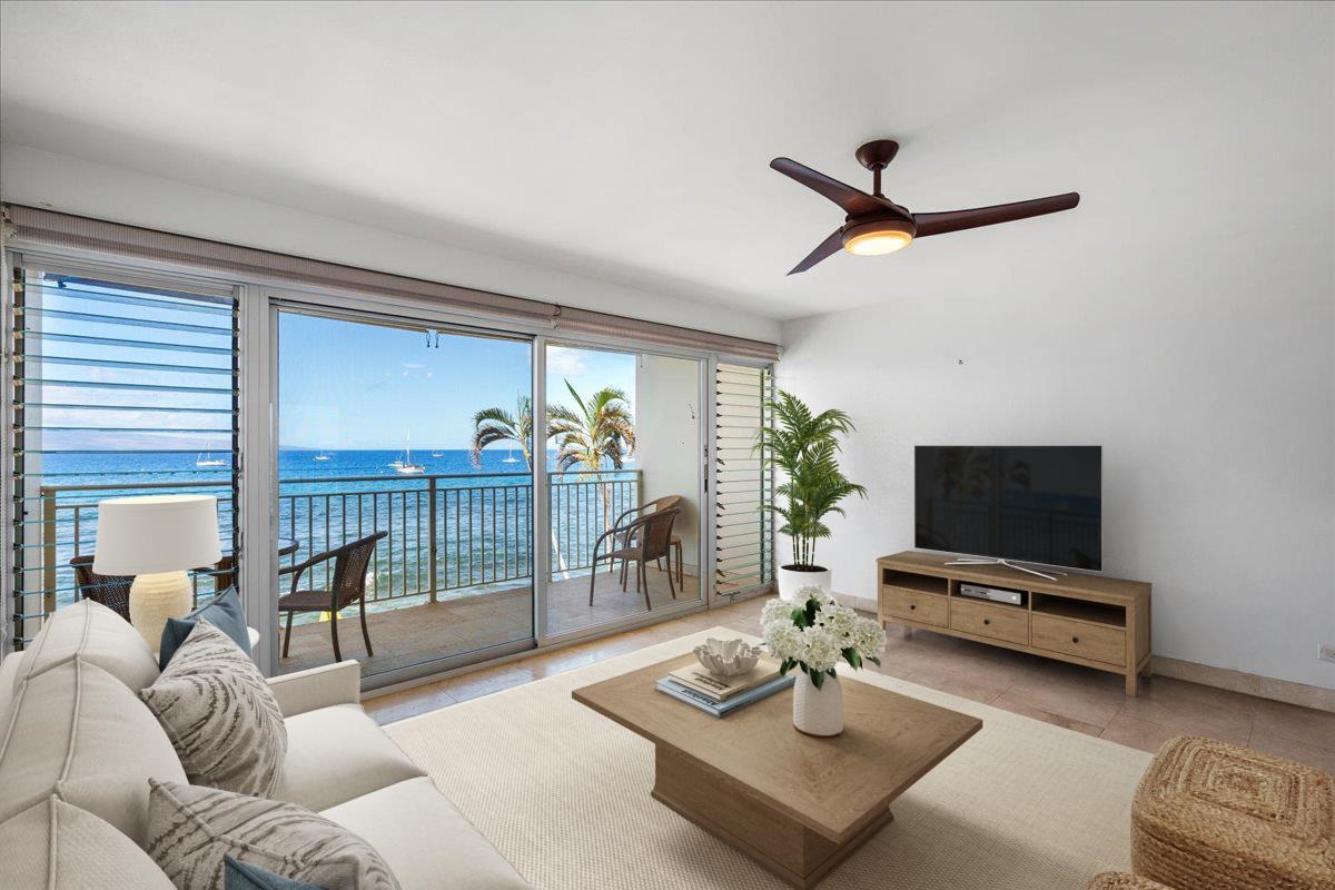 1403 Front Street, Unit 309 Lahaina, HI 96761 - Photo 4 of 33 a living room with furniture and a flat screen tv