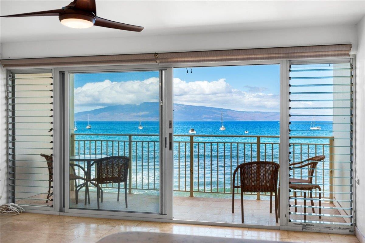 1403 Front Street, Unit 309 Lahaina, HI 96761 - Photo 6 of 33 a chair and a table in a balcony