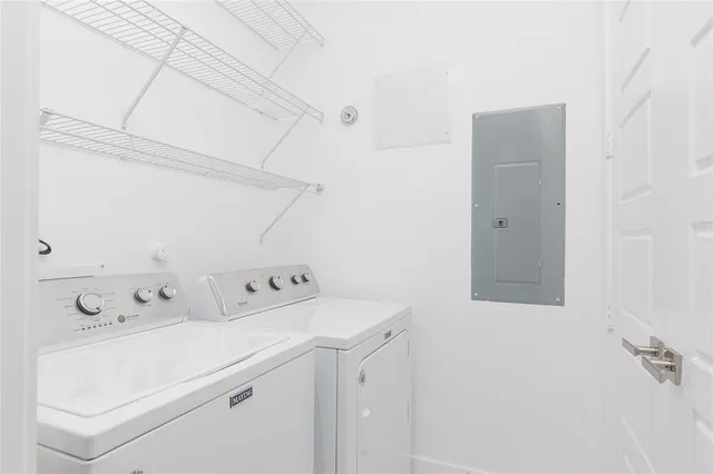 a utility room with dryer and washer