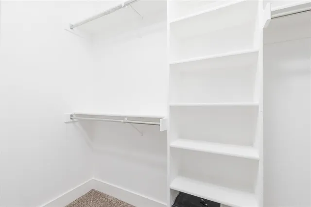 a view of an empty walk in closet