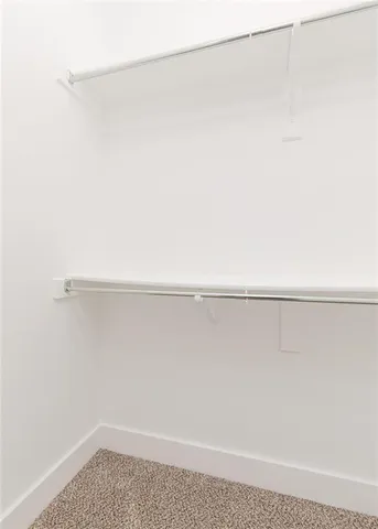 a view of a room with racks on the wall