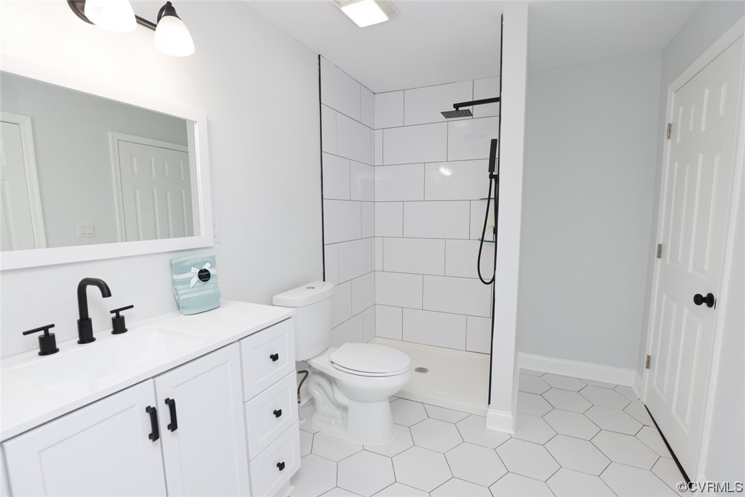 6830 Strathmore Road Richmond, VA 23237 - Photo 13 of 47 a bathroom with a sink a toilet and shower