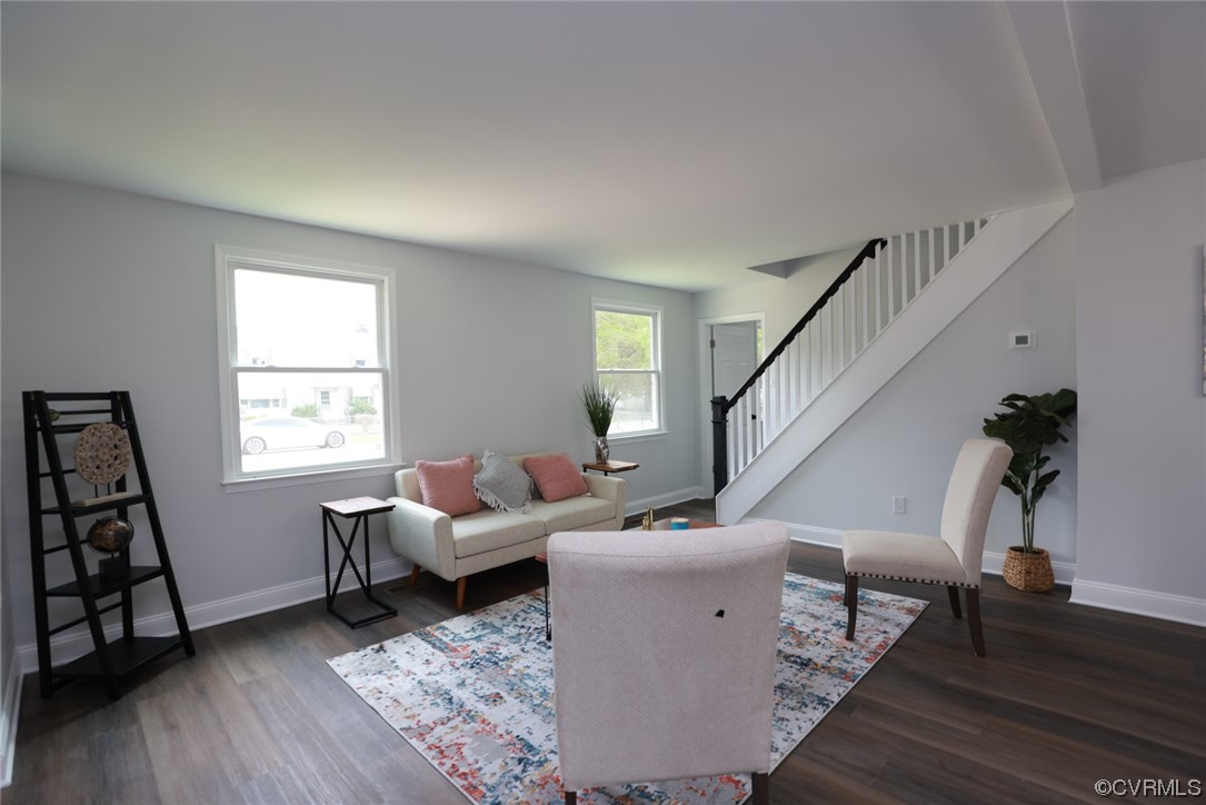 6830 Strathmore Road Richmond, VA 23237 - Photo 2 of 47 a living room with furniture and wooden floor