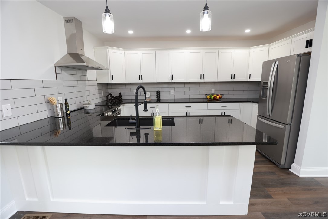 6830 Strathmore Road Richmond, VA 23237 - Photo 21 of 47 a kitchen with stainless steel appliances granite countertop a sink a refrigerator and a stove