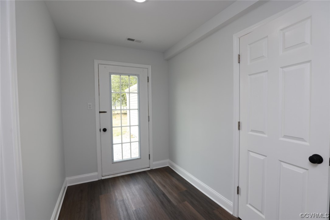 6830 Strathmore Road Richmond, VA 23237 - Photo 23 of 47 a view of an empty room with wooden floor and a window