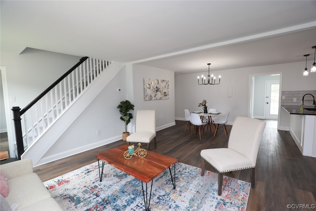 6830 Strathmore Road Richmond, VA 23237 - Photo 30 of 47 a living room with furniture and wooden floor