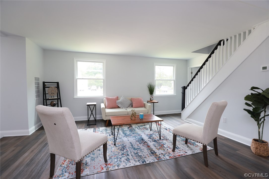 6830 Strathmore Road Richmond, VA 23237 - Photo 3 of 47 a living room with furniture and a wooden floor