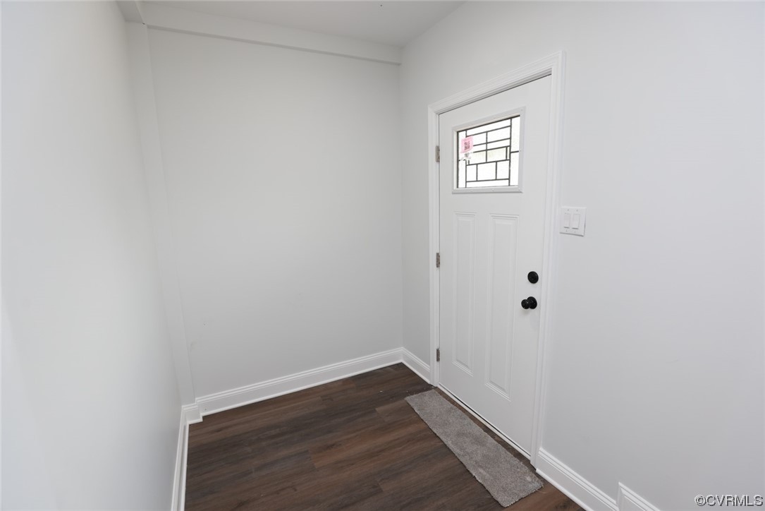 6830 Strathmore Road Richmond, VA 23237 - Photo 31 of 47 a view of an empty room with wooden floor and a window