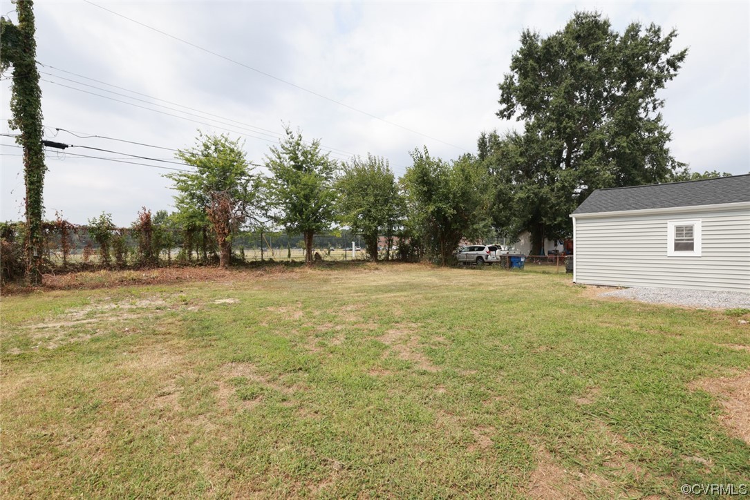6830 Strathmore Road Richmond, VA 23237 - Photo 40 of 47 a view of outdoor space with deck and yard