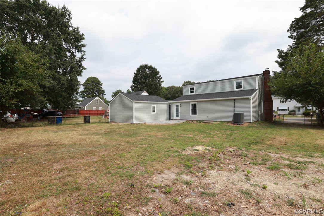 6830 Strathmore Road Richmond, VA 23237 - Photo 41 of 47 a front view of a house with a yard and garage