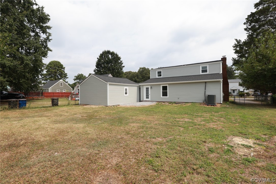 6830 Strathmore Road Richmond, VA 23237 - Photo 42 of 47 a front view of a house with a yard and garage