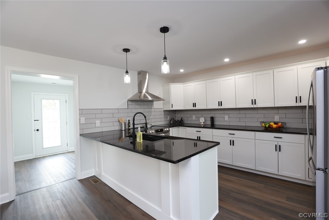 6830 Strathmore Road Richmond, VA 23237 - Photo 7 of 47 a kitchen with granite countertop a sink a counter space appliances and cabinets