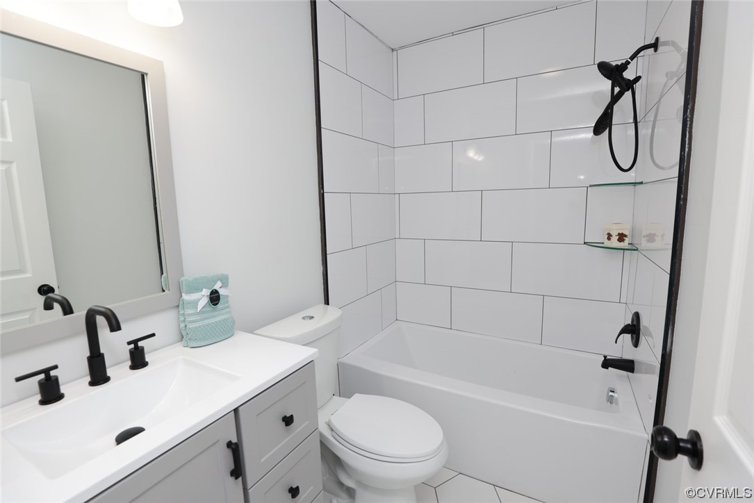 6830 Strathmore Road Richmond, VA 23237 - Photo 8 of 47 a bathroom with a sink a toilet and shower