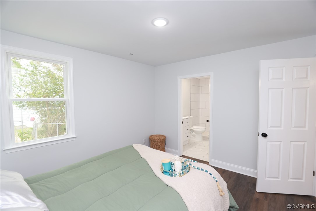 6830 Strathmore Road Richmond, VA 23237 - Photo 9 of 47 a bedroom with a bed and a window