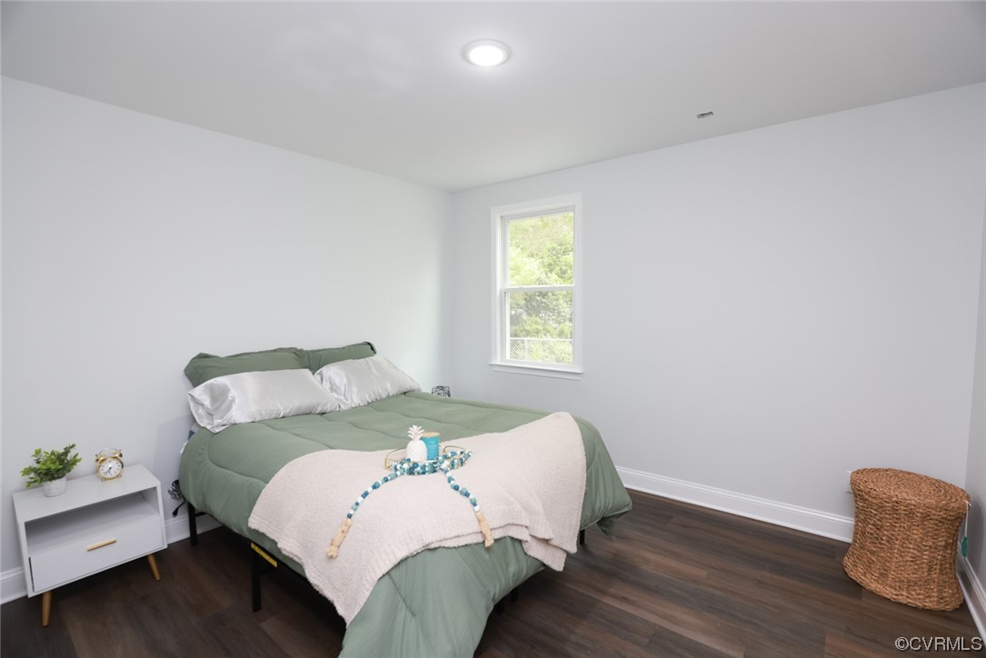 6830 Strathmore Road Richmond, VA 23237 - Photo 10 of 47 a bedroom with a bed and window