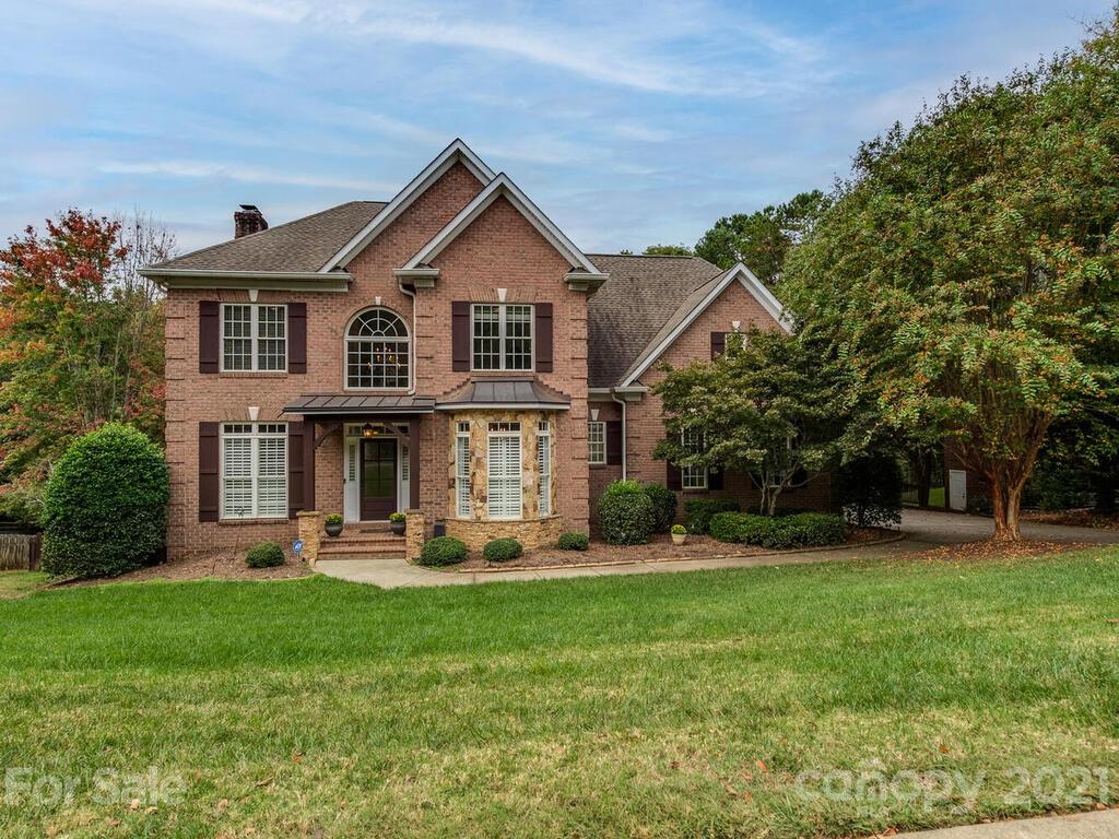 3115 Planters Ridge Road Charlotte, NC 28270 - Photo 1 of 44 a front view of a house with garden