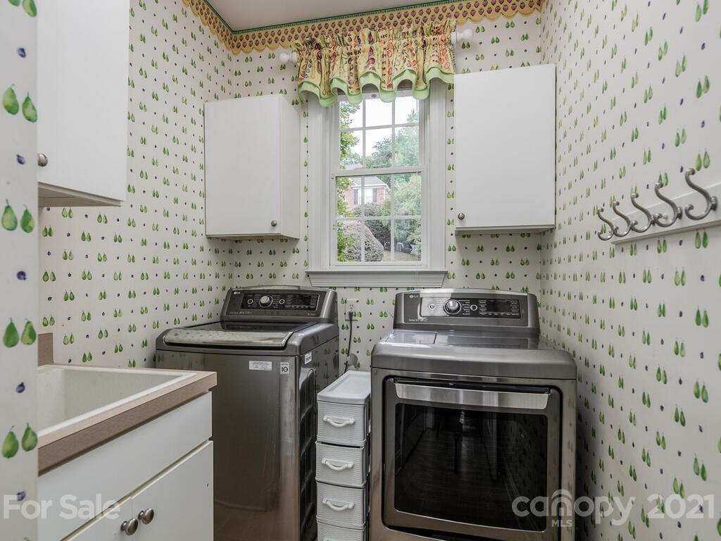 3115 Planters Ridge Road Charlotte, NC 28270 - Photo 17 of 44 a kitchen with a stove sink and cabinets