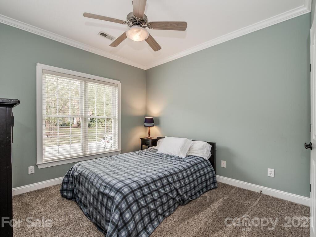 3115 Planters Ridge Road Charlotte, NC 28270 - Photo 21 of 44 a bedroom with a large bed and a window