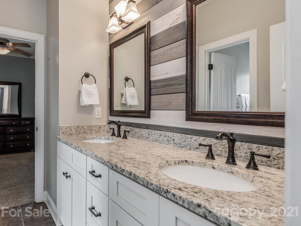 3115 Planters Ridge Road Charlotte, NC 28270 - Photo 22 of 44 a bathroom with a granite countertop double vanity sink and a mirror
