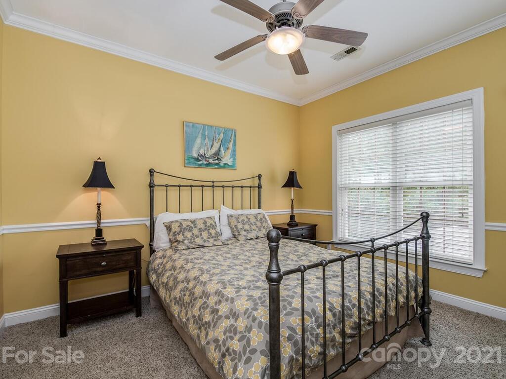 3115 Planters Ridge Road Charlotte, NC 28270 - Photo 24 of 44 a bedroom with furniture and a window