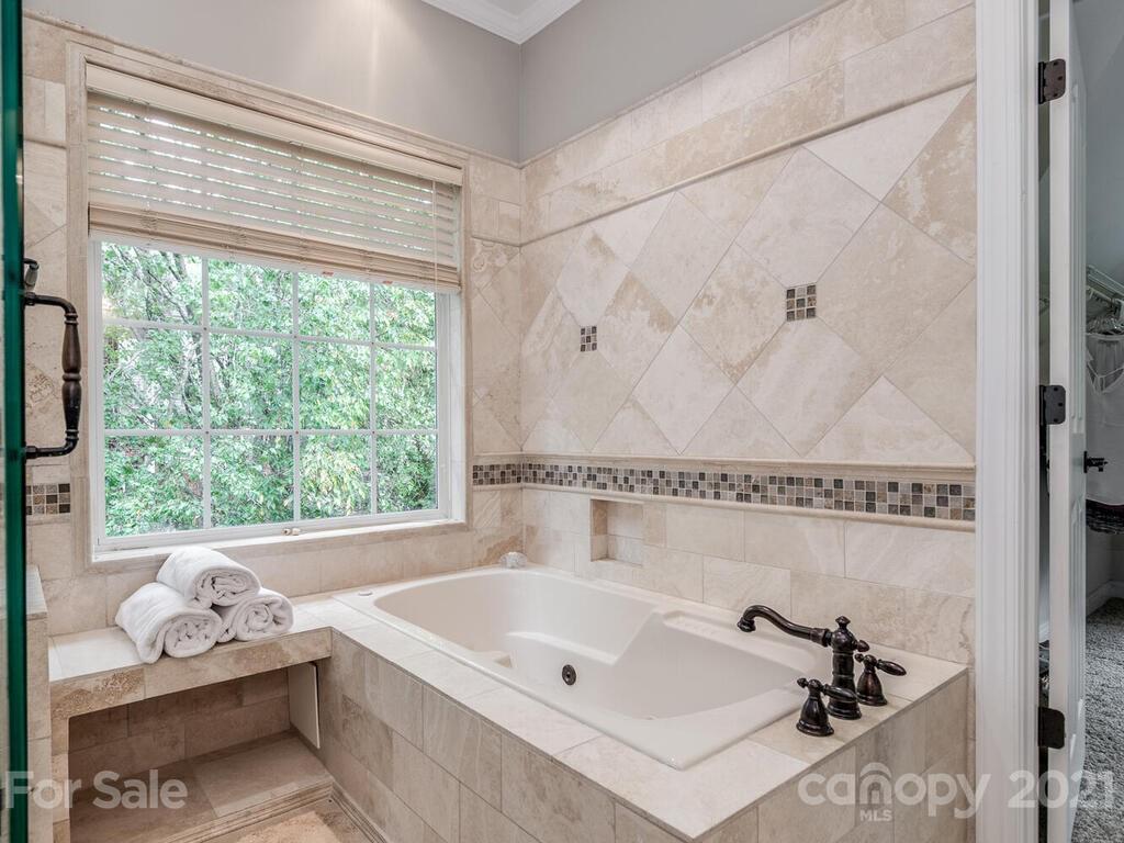 3115 Planters Ridge Road Charlotte, NC 28270 - Photo 30 of 44 a bath tub sitting next to a window