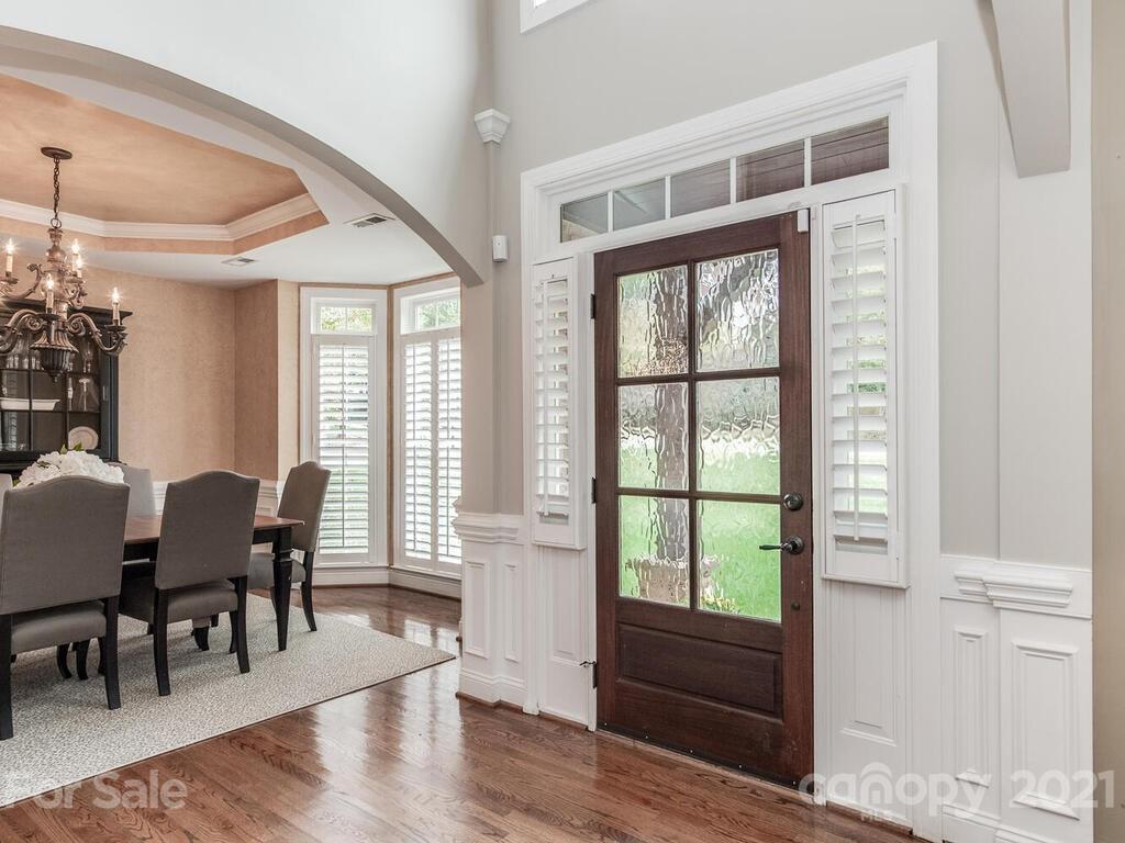 3115 Planters Ridge Road Charlotte, NC 28270 - Photo 4 of 44 a view of a dining room with furniture window and wooden floor