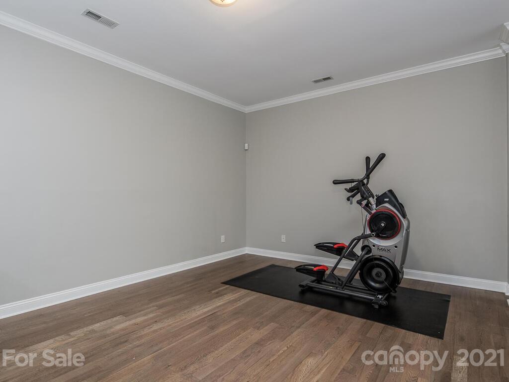 3115 Planters Ridge Road Charlotte, NC 28270 - Photo 35 of 44 a view of a room with wooden floor and a mirror