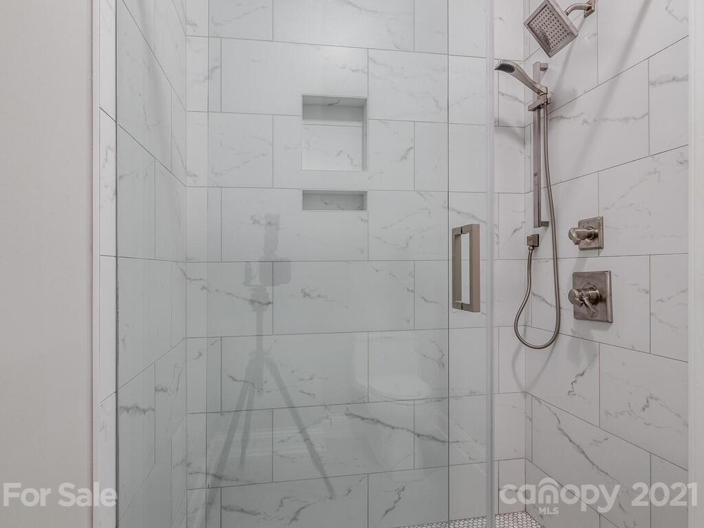 3115 Planters Ridge Road Charlotte, NC 28270 - Photo 38 of 44 a bathroom with a glass shower door