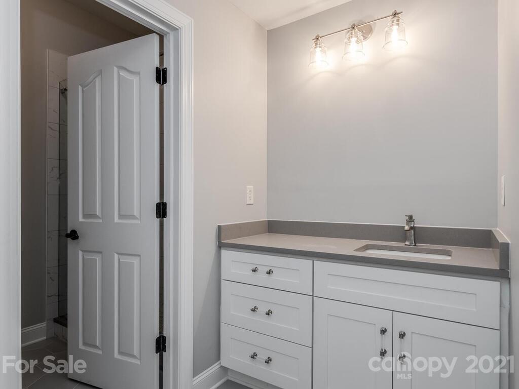 3115 Planters Ridge Road Charlotte, NC 28270 - Photo 39 of 44 a bathroom with a granite countertop sink and vanity