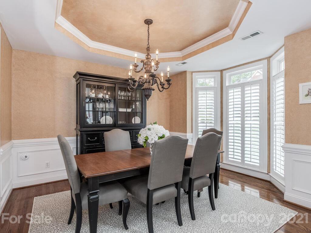 3115 Planters Ridge Road Charlotte, NC 28270 - Photo 5 of 44 a view of a dining room with furniture and window
