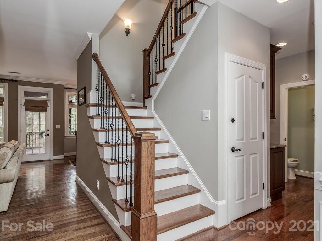 3115 Planters Ridge Road Charlotte, NC 28270 - Photo 6 of 44 a view of staircase with lots of frames on wall and wooden floor