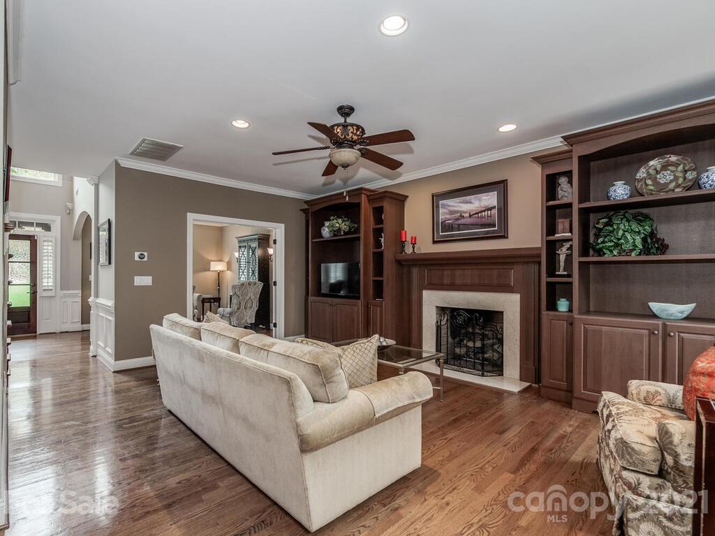 3115 Planters Ridge Road Charlotte, NC 28270 - Photo 10 of 44 a living room with furniture and a fireplace