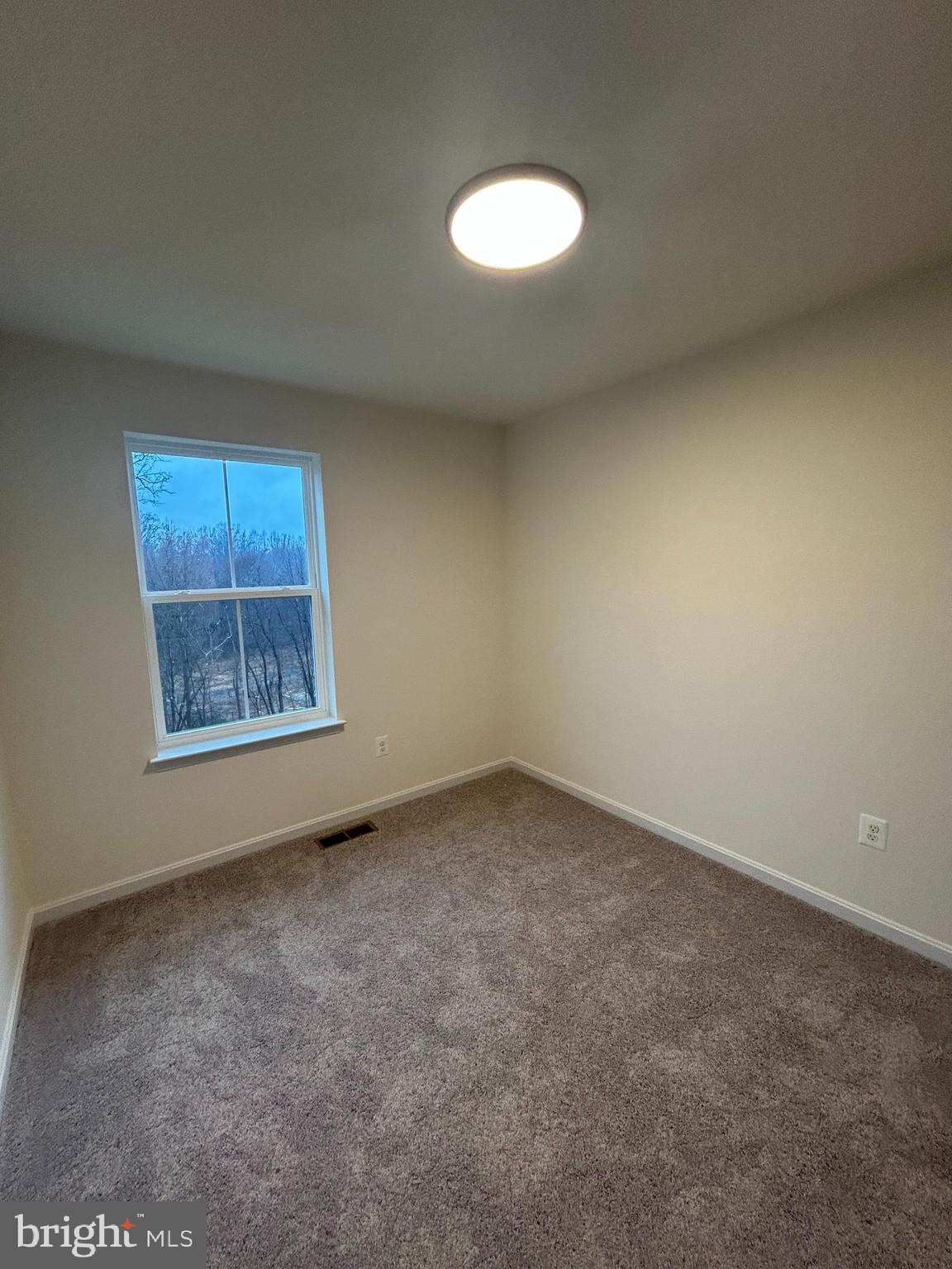 7300 Roxy Run, Unit 6 Clinton, MD 20735 - Photo 15 of 34 a view of an empty room with a window