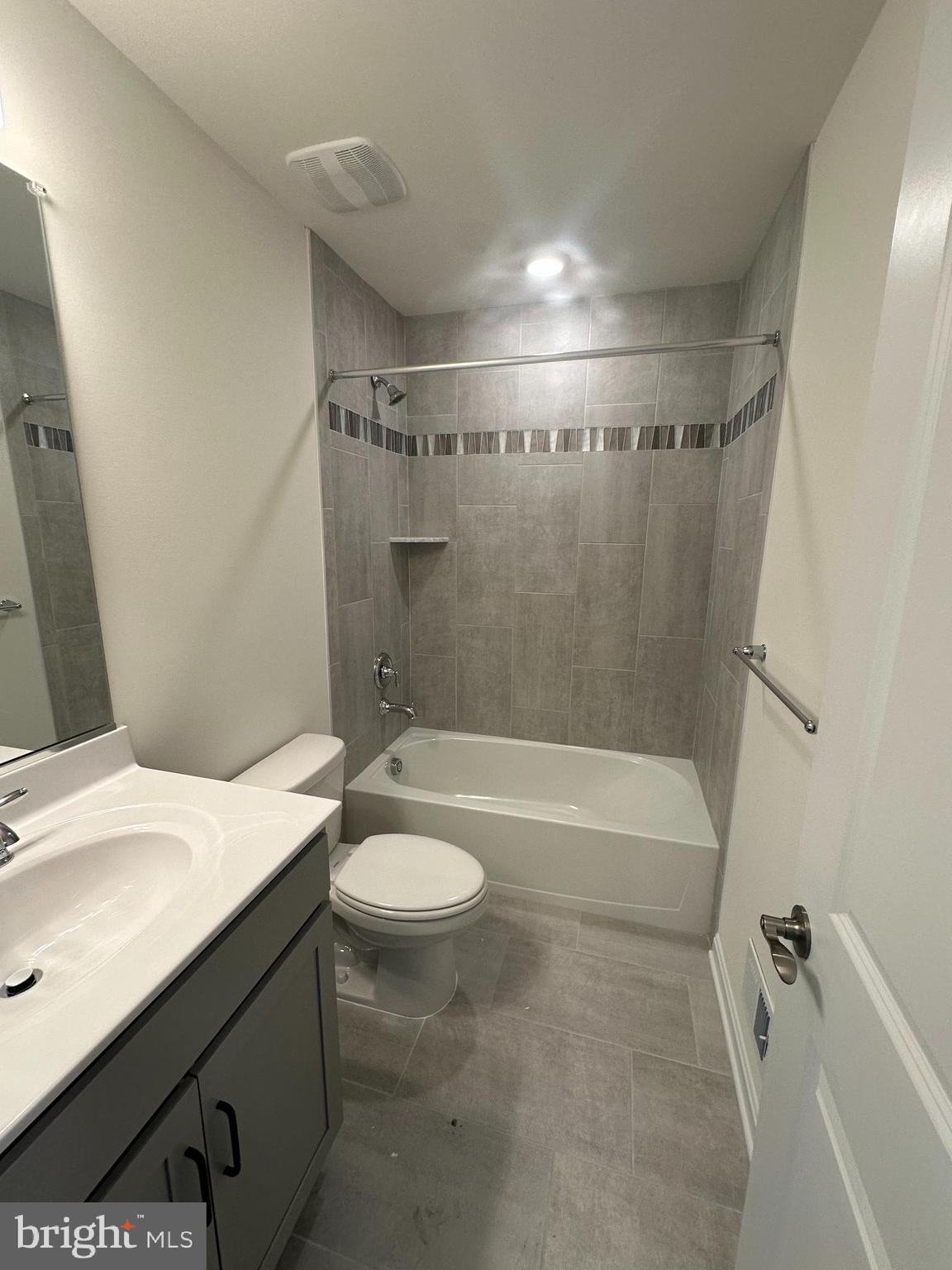 7300 Roxy Run, Unit 6 Clinton, MD 20735 - Photo 20 of 34 a bathroom with a granite countertop sink toilet and shower