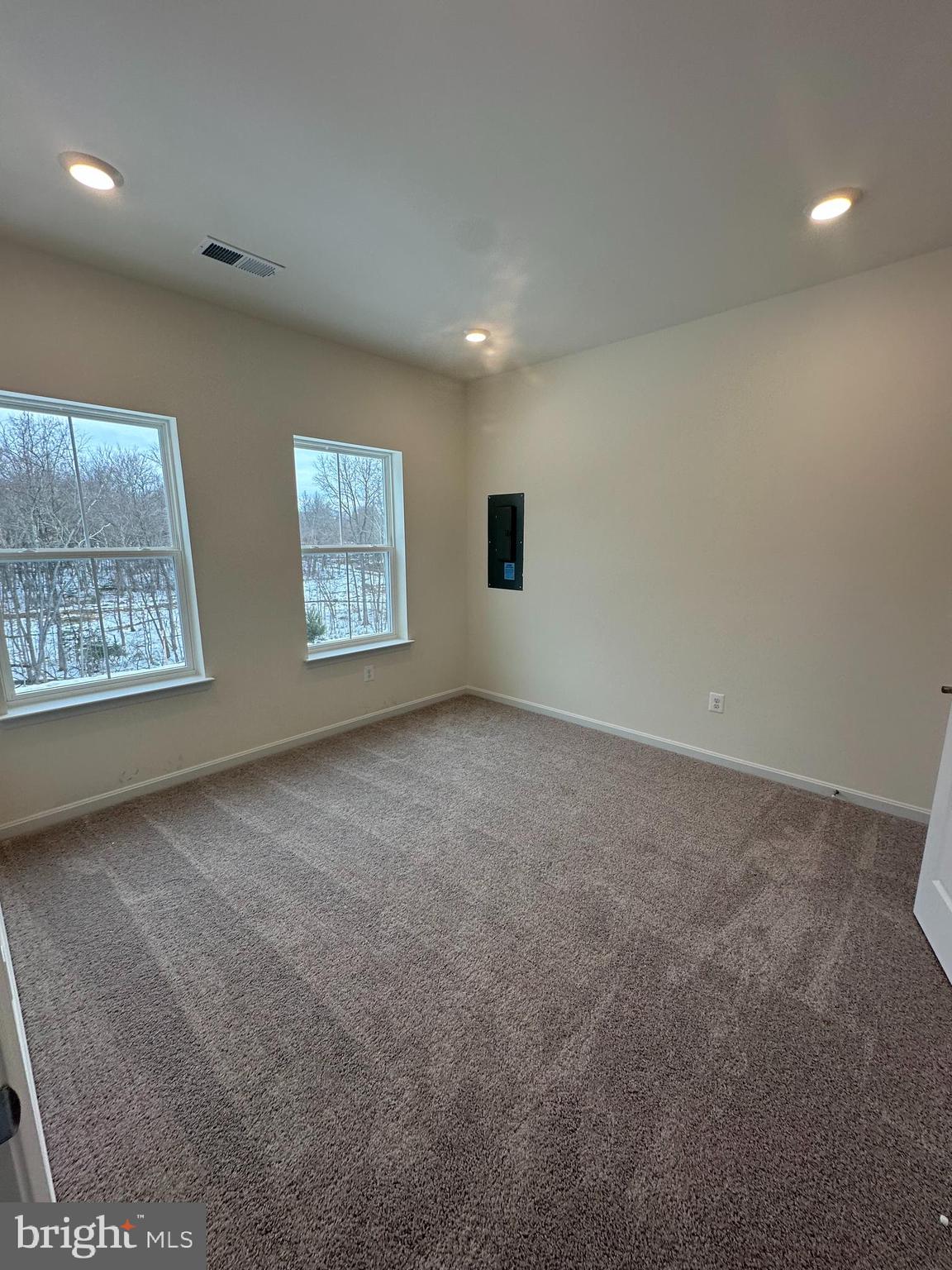 7300 Roxy Run, Unit 6 Clinton, MD 20735 - Photo 21 of 34 a view of an empty room with windows