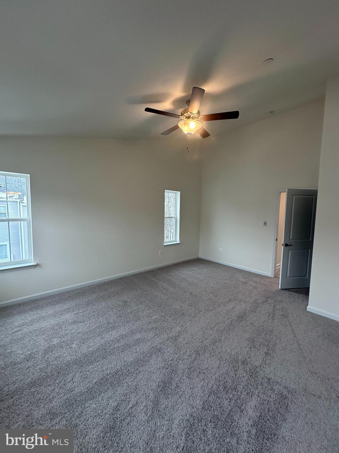 7300 Roxy Run, Unit 6 Clinton, MD 20735 - Photo 25 of 34 an empty room with windows and fan