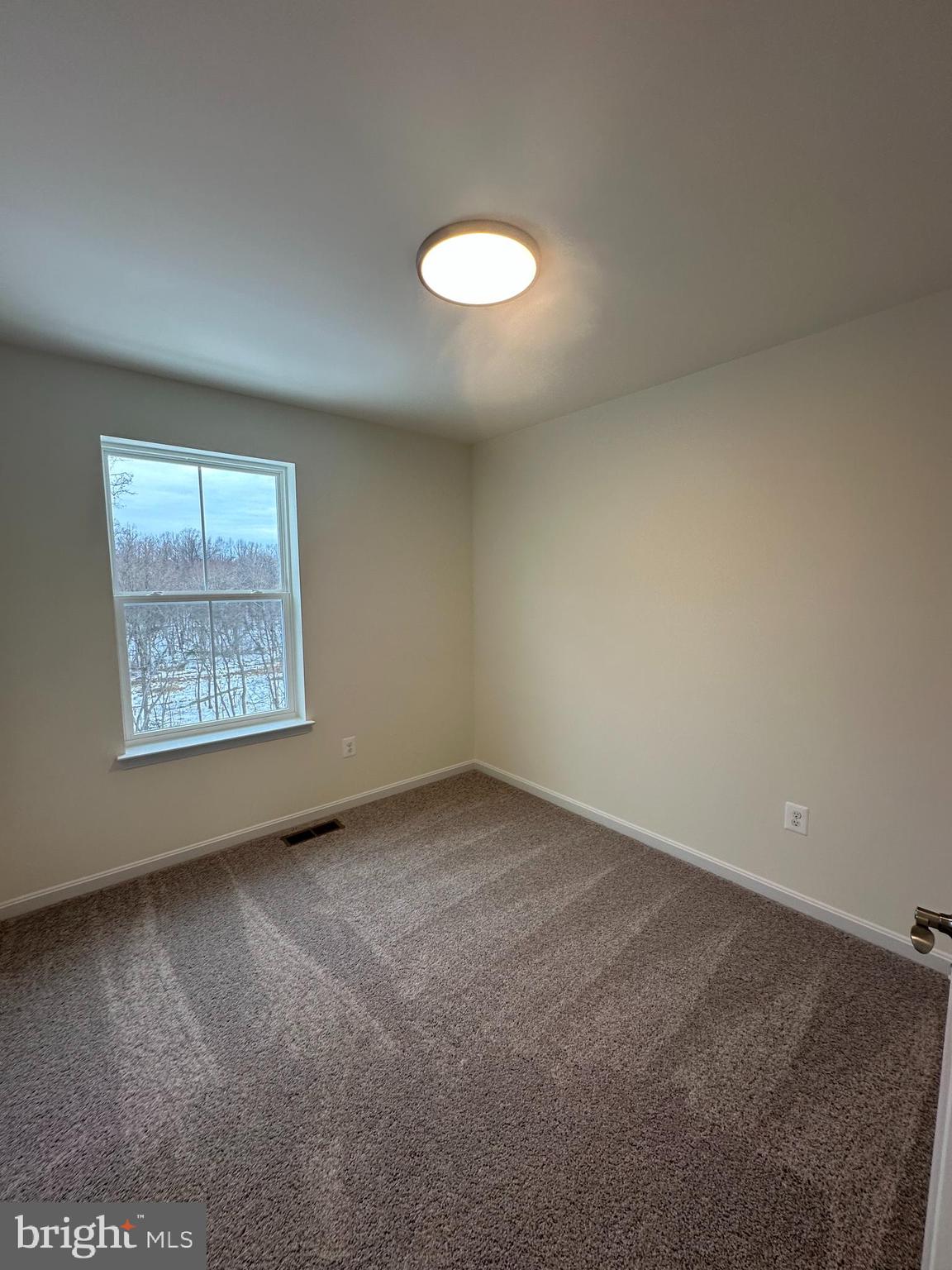 7300 Roxy Run, Unit 6 Clinton, MD 20735 - Photo 27 of 34 an empty room with a window