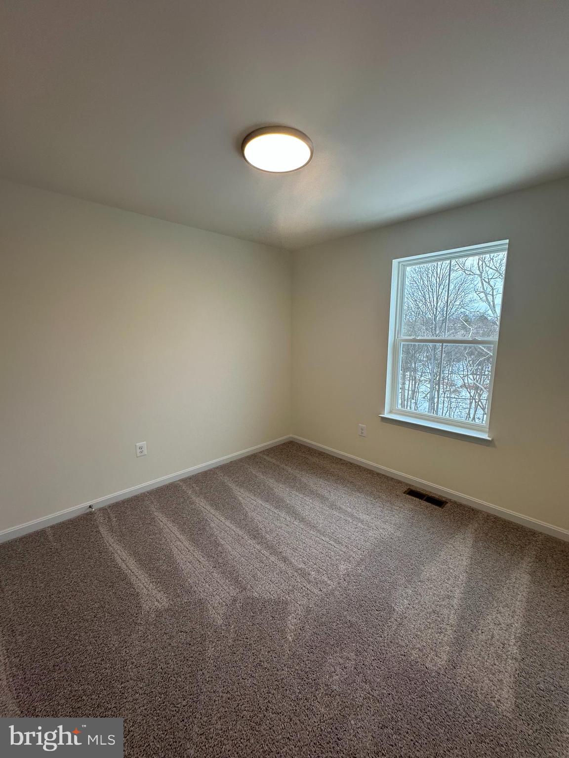 7300 Roxy Run, Unit 6 Clinton, MD 20735 - Photo 28 of 34 an empty room with a window