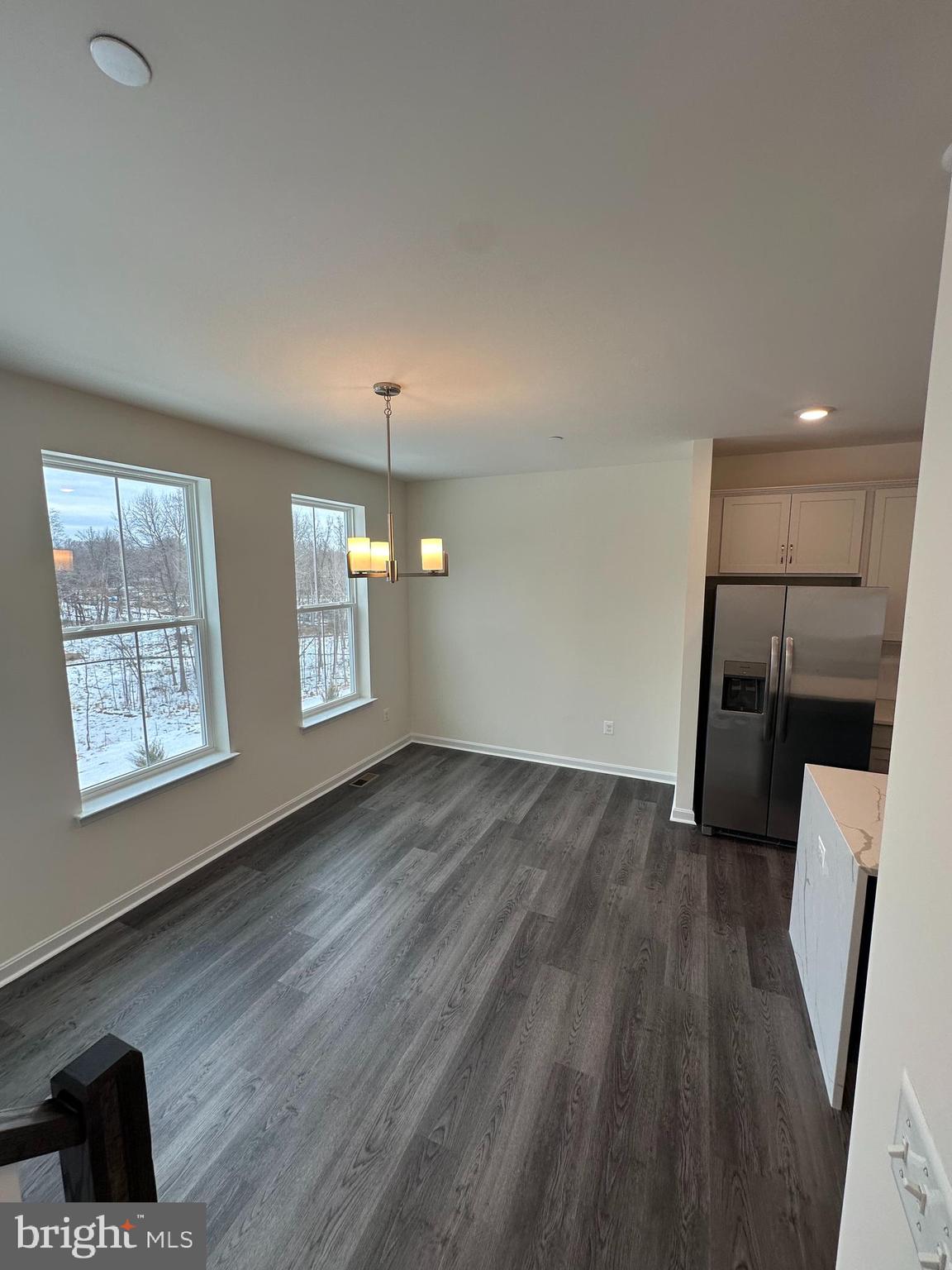 7300 Roxy Run, Unit 6 Clinton, MD 20735 - Photo 29 of 34 a view of an empty room with wooden floor and a window