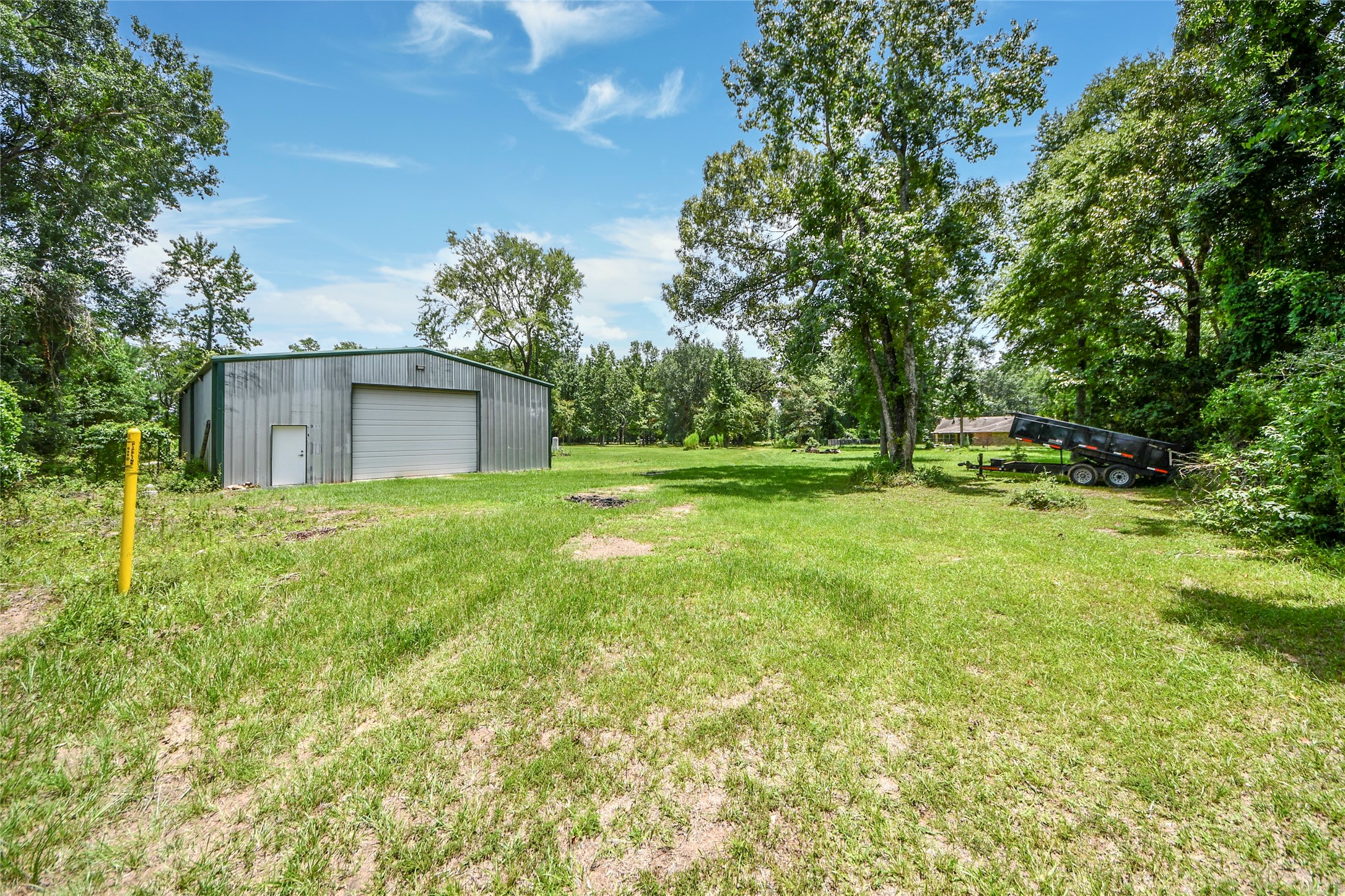 8330 Standard Road Magnolia, TX 77354 - Photo 13 of 13 a front view of house with yard and trees
