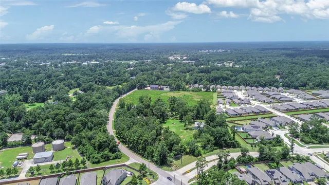 a backyard of a house with a garden and deck
