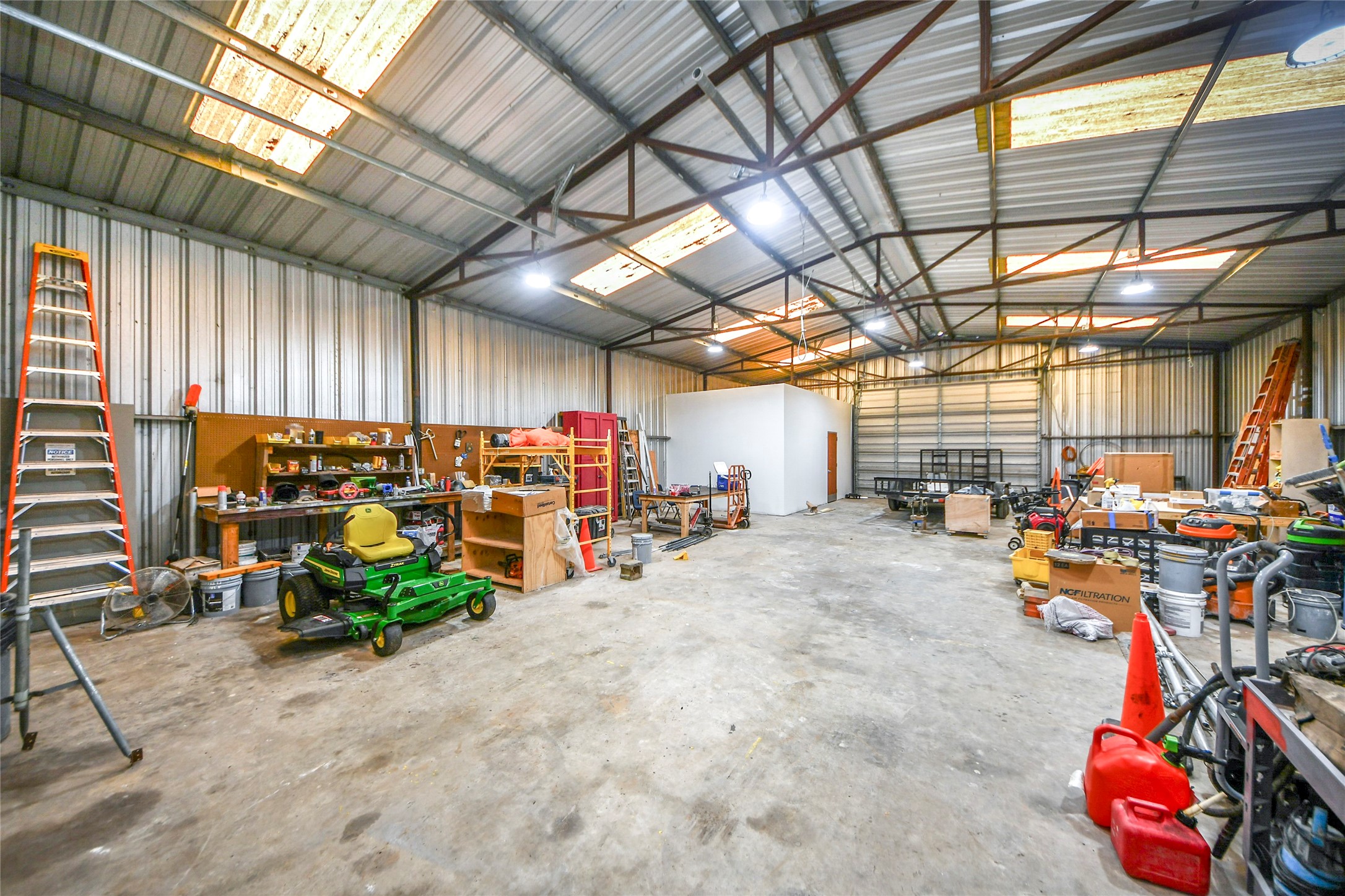 8330 Standard Road Magnolia, TX 77354 - Photo 8 of 13 a view of a storage room with gym equipment