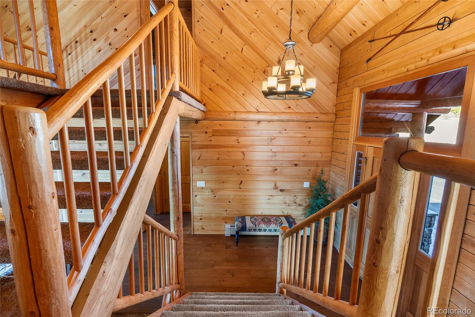 685 Jesse Lane Bailey, CO 80421 - Photo 17 of 50 a view of entryway with wooden floor and stairs