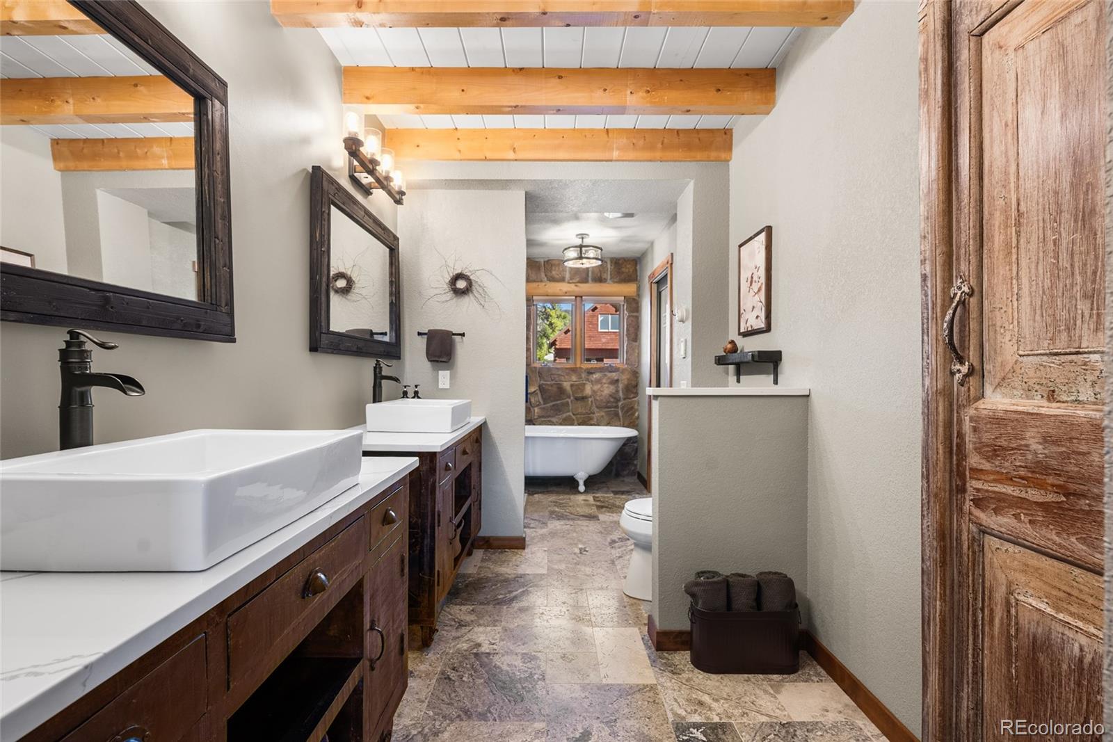 685 Jesse Lane Bailey, CO 80421 - Photo 21 of 50 a bathroom with a sink a mirror and a toilet